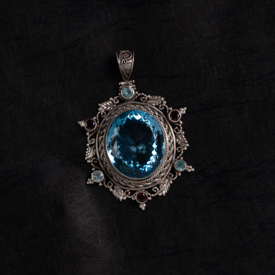 Blue Topaz Starburst Silver Pendant – Clarity & Expression
