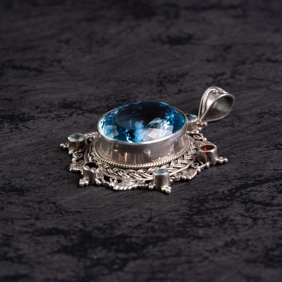 Blue Topaz Starburst Silver Pendant – Clarity & Expression